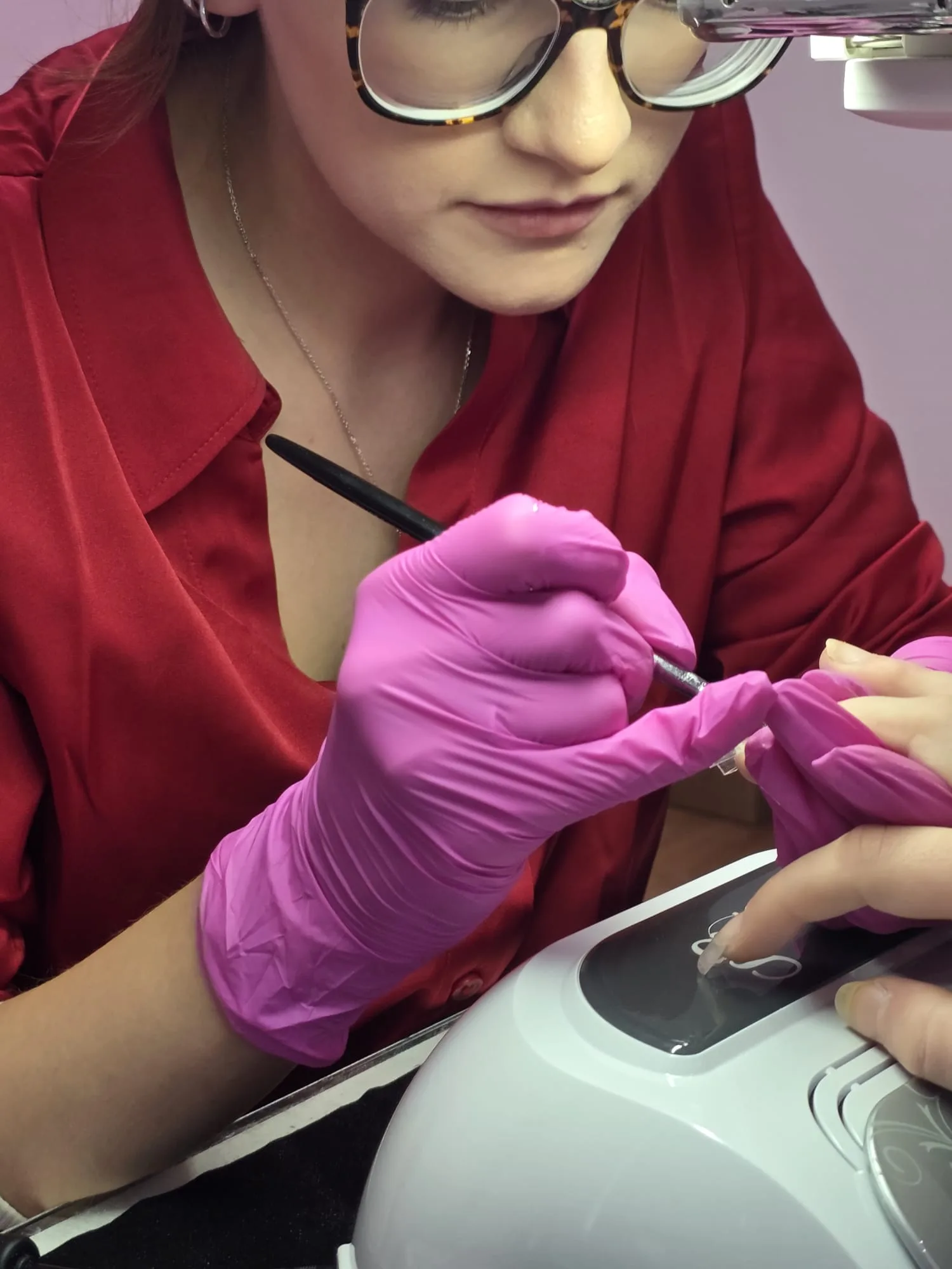 Nail application being demonstrated at the Training Academy